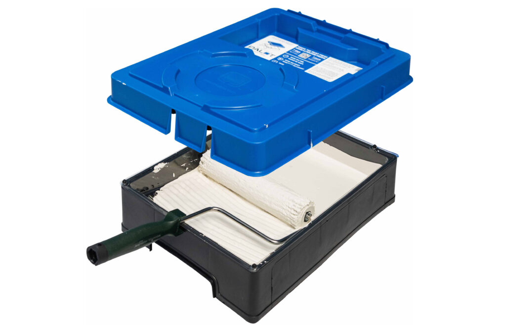 A view of the inside of a paint train filled with white paint and a roller, while a Blue PALOT TRAY PAL lid hovers over top.